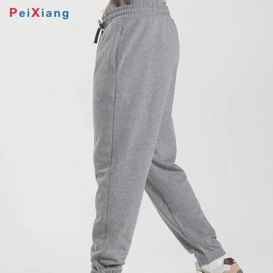 Man walking in light grey tapered jogger pants