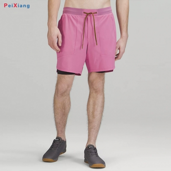 Men's pink athletic basketball shorts front view