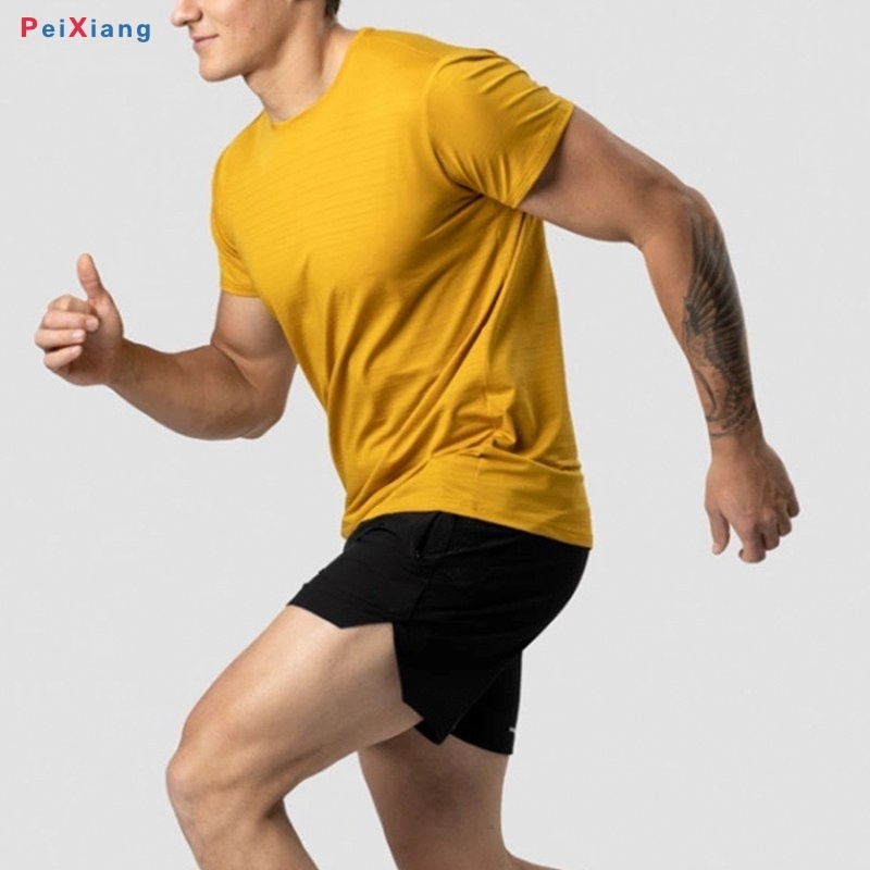 Men's mustard yellow cropped training tee side motion