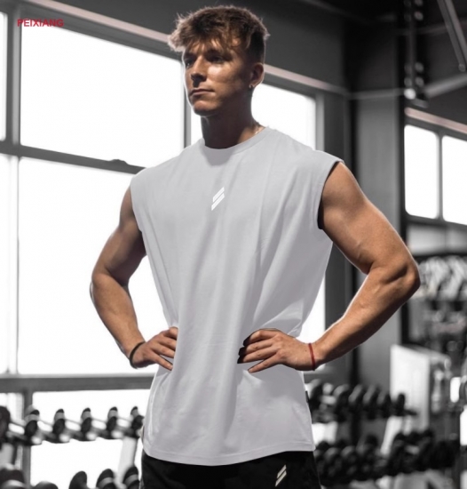 Man training with battle ropes in light blue sport vest