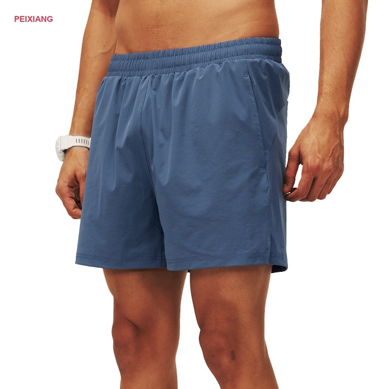 Men's lime yellow running shorts side zip pocket detail